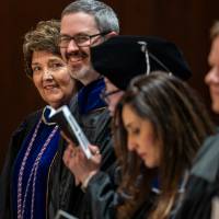 Faculty gathering at their seats